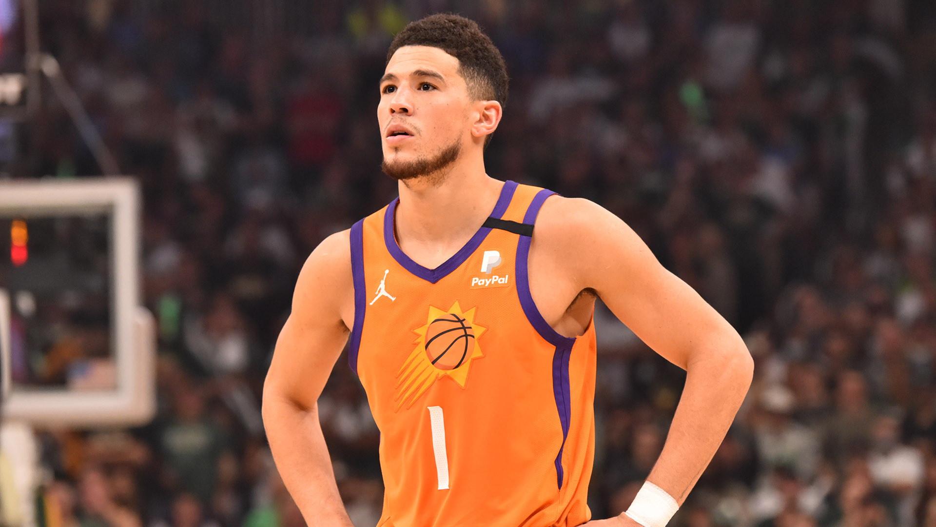 Suns' Devin Booker will miss start of camp due to health protocols ...